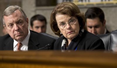 FILE - In this June 12, 2013, file photo, Sen. Dianne Feinstein, D-Calif., right, chair of the Senate Intelligence Committee, and Sen. Dick Durbin, D-Ill., listen to testimony from Gen. Keith B. Alexander, director of the National Security Agency and head of the U.S. Cyber Command before the Senate Appropriations Committee. U.S. authorities have said they are reducing the amount of time they will delay deporting the few immigrants in the country illegally awaiting congressional decisions to legalize their immigration status after lawmakers file so-called &quot;private bills&quot; supporting their last-ditch bids to remain in the country. Senators Durbin and Feinstein criticized the decision to change longstanding practices they said was made without consulting lawmakers. (AP Photo/J. Scott Applewhite, File)