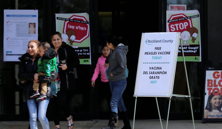 Sign advertising free measles vaccines and information about measles are displayed at the Rockland County Health Department in Pomona, N.Y., Wednesday, March 27, 2019. The county in New York City&#39;s northern suburbs declared a local state of emergency Tuesday over a measles outbreak that has infected more than 150 people since last fall, hoping a ban against unvaccinated children in public places wakes their parents to the seriousness of the problem. (AP Photo/Seth Wenig)