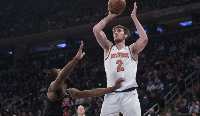 New York Knicks forward Luke Kornet (2) goes to the basket against Chicago Bulls forward JaKarr Sampson (14) during the first half of an NBA basketball game, Monday, April 1, 2019, at Madison Square Garden in New York. (AP Photo/Mary Altaffer)