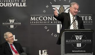 Senator Tim Kaine, right, makes a point while giving a speech at the University of Louisville Monday, April 1, 2019, in Louisville KY. On left is Senate Majority Leader Mitch McConnell. (Pat McDonogh/Courier Journal via AP)