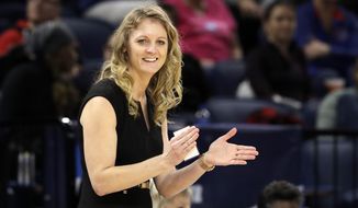 Missouri State head coach Kellie Harper smiles as he directs her team during the second half of a regional semifinal game against the Stanford in the NCAA women&#39;s college basketball tournament, Saturday, March 30, 2019, in Chicago. (AP Photo/Nam Y. Huh)