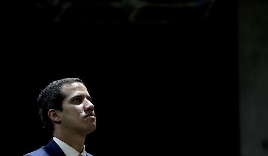 Juan Guaido, Venezuelan opposition leader and self-proclaimed interim president, attends a meeting at a university in Caracas, Venezuela, Monday, April 1, 2019. He’s backed by more than 50 nations, which consider Nicolas Maduro’s presidency illegitimate following what they call sham elections last year. “We must unite now more than ever,” said Guaido, speaking at the university. "We must mount the biggest demonstration so far to reject what’s happening." (AP Photo/Natacha Pisarenko)