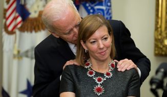 There are tons of photos of former Vice President Joseph R. Biden laying his hands on women, including this one from 2015, where he rubs Stephanie Carter&#x27;s shoulders. (Associated Press)
