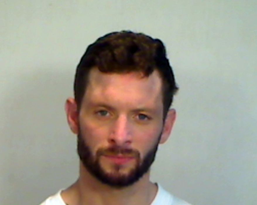 In this photo made available by the Monroe County Sheriff's Office, William Hunter Hardesty is seen under arrest, Monday, April 1, 2019. Hardesty of Riva, MD., is accused of abusing a pelican by jumping on the bird as it floated next to the Key West Historic Seaport. (Monroe County Sheriff's Office via AP)