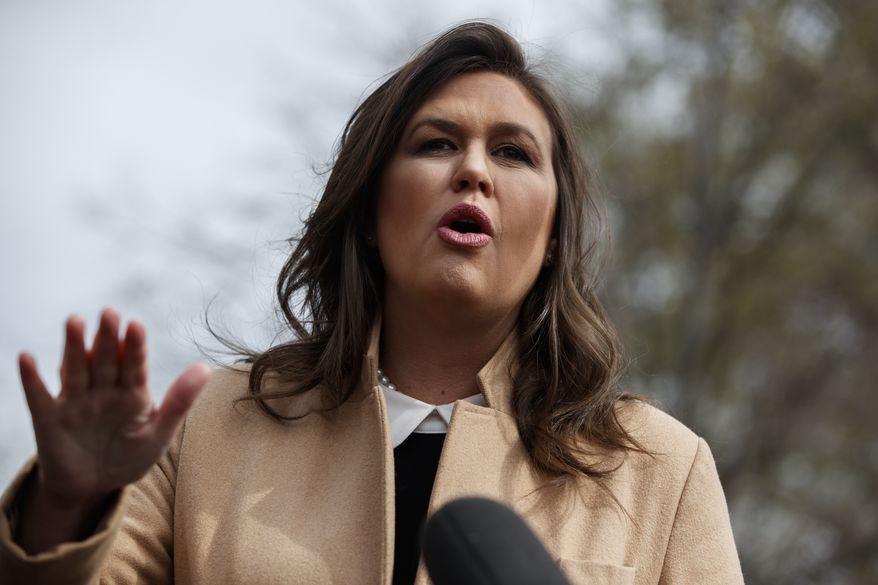 White House press secretary Sarah Sanders talks with reporters outside the White House, Tuesday, April 2, 2019, in Washington. (AP Photo/Evan Vucci)