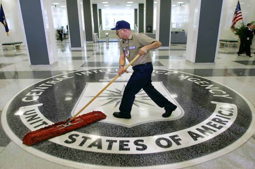 FILE - In this March 3, 2005, file photo, a workman dusts the floor at the Central Intelligence Agency headquarters in Langley, Va. The American Civil Liberties Union has filed a lawsuit challenging a pre-publication review required for people who have had access to government secrets. The CIA says the pre-publication review is necessary to protect national security and protect former employees from legal liability. Timothy Barrett, a CIA spokesman, said the agency “does not comment on pending litigation." (AP Photo/J. Scott Applewhite, File)