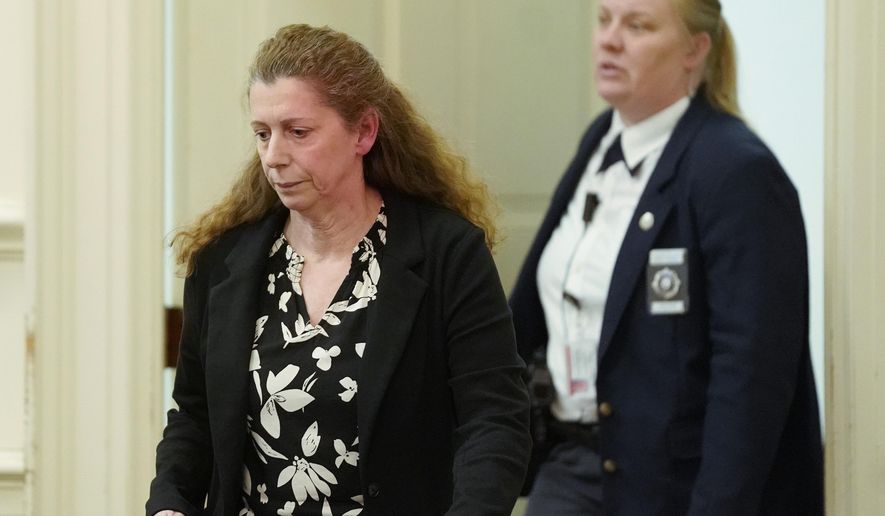 Carol Sharrow enters a courtroom at York County Superior Court in Alfred, Maine, on Tuesday, April 2, 2019. Sharrow was charged with the hit-and-run death of Douglas Parkhurst after she drove her car on to a baseball field in Sanford last June while a Babe Ruth League game was in progress. Sharrow was found not criminally responsible for the death because she had a manic episode at the time of the incident and did not have the ability to understand the wrongfulness of her behavior. She will be held at Riverview Psychiatric Center in Augusta. (Gregory Rec/Portland Press Herald via AP)