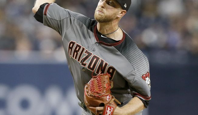 Arizona Diamondbacks starting pitcher Merrill Kelly delivers to a San Diego Padres batter during the first inning of a baseball game in San Diego, Monday, April 1, 2019. (AP Photo/Alex Gallardo)