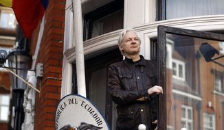 In this Friday, May 19, 2017, file photo, WikiLeaks founder Julian Assange greets supporters outside the Ecuadorian Embassy in London. (AP Photo/Frank Augstein, File)