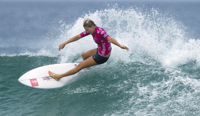 FILE - In this May 12, 2012, file photo, Australia&#x27;s Stephanie Gilmore competes in the Association of Surfing Professionals, ASP, Billabong Rio Pro women&#x27;s surfing competition at Barra da Tijuca beach in Rio de Janeiro, Brazil. Qualifying for the inaugural Olympic surfing competition at Tokyo 2020 has begun at Australia&#x27;s Gold Coast with a World Surf League event where seven-time world champion Gilmore leads the women&#x27;s field. Defending Gold Coast champion and fellow Australian Julian Wilson feature in a strong men&#x27;s field that includes American great and 11-time world champion Kelly Slater and reigning series champion Gabriel Medina. (AP Photo/Felipe Dana, File)