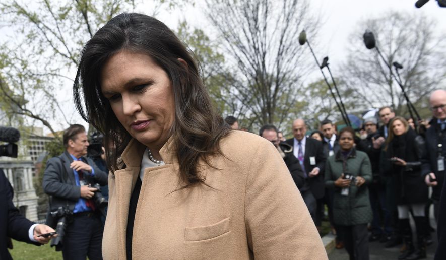 White House press secretary Sarah Sanders turns to go back into the White House in Washington after speaking to reporters, Tuesday, April 2, 2019. (AP Photo/Susan Walsh)