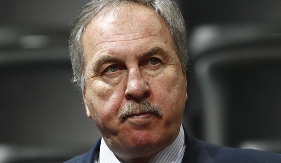 FILE - In this March 8, 2017, file photo, Washington Wizards general manager Ernie Grunfeld watches during the first half of an NBA basketball game in Denver. Grunfeld has been fired as president of the Washington Wizards after 16 seasons in charge of the team. The Wizards announced his dismissal on Tuesday, April 2, 2019,  with four games left in a disappointing, no-playoffs season.(AP Photo/David Zalubowski) ** FILE **