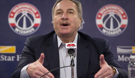 FILE - In this April 14, 2016, file photo, Washington Wizards basketball President Ernie Grunfeld speaks during a news conference at the Verizon Center in Washington. Grunfeld has been fired as president of the Washington Wizards after 16 seasons in charge of the team. The Wizards announced his dismissal on Tuesday, April 2, 2019,  with four games left in a disappointing, no-playoffs season. (AP Photo/Pablo Martinez Monsivais, File)