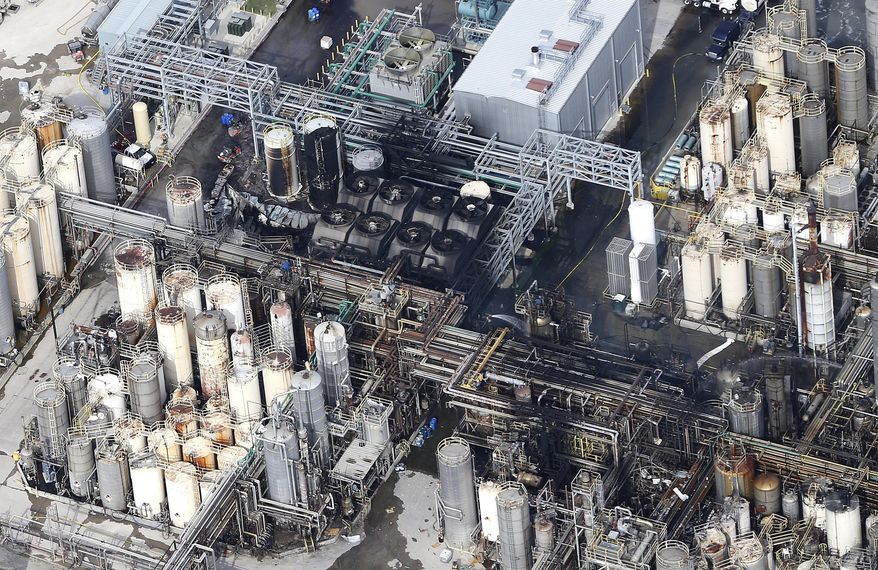 This aerial photo shows the KMCO chemical plant as firefighters spray water on a fire on Tuesday, April 2, 2019, in Crosby, Texas. Pilar Davis, a product manager with KMCO, says the fire initially ignited with isobutylene and was fueled by ethanol and ethyl acrylate. All three are chemicals and solvents used to make fuel additives at the plant. (Elizabeth Conley/Houston Chronicle via AP)