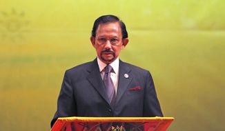In this Oct, 10, 2013, file photo, Brunei&#39;s Sultan Hassanal Bolkiah speaks during the closing ceremony and handover of the ASEAN Chairmanship to Myanmar in Bandar Seri Begawan. The sultan announced to implement Islamic criminal laws that punishes gay sex by stoning offenders to death. The legal change in the tiny, oil-rich monarchy, which also includes amputation for theft, is due to come into force Wednesday, April 3, 2019. (AP Photo/Vincent Thian)
