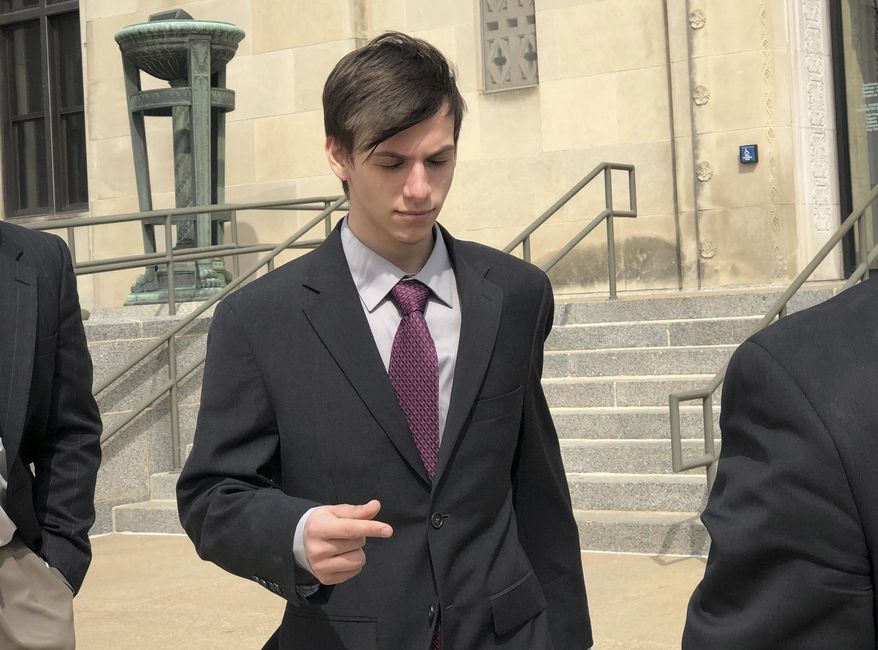 Casey Viner, an Ohio gamer accused of recruiting a prankster to make a bogus emergency call, leaves federal court in Wichita, Kansas, Wednesday, April, 3, 2019, after changing his plea to guilty for his alleged part in the hoax that got an unarmed Kansas man killed by police. Viner, 19, of North College Hill, Ohio, pleaded guilty to conspiracy and obstruction of justice charges. Authorities say Viner recruited Tyler Barriss of Los Angeles to "swat" an online opponent over a $1.50 bet. (AP Photo/Roxana Hegeman)
