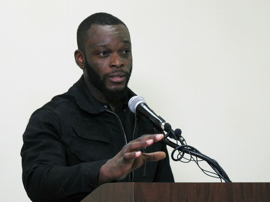 Shamieke Pugh recounts being stabbed by a fellow inmate at an Ohio prison and discusses a related new lawsuit against prison officers during a news conference Wednesday, April 3, 2019, in Columbus, Ohio. The lawsuit alleges officers at an Ohio prison watched as an inmate slipped his handcuffs, pulled out a blade, and stabbed Pugh and three other fellow prisoners who were handcuffed to a table. The civil rights lawsuit filed Wednesday by two of the injured men alleges officers hadn't strip-searched the attacker as required and didn't provide first aid to the bleeding inmates. (AP Photo/Kantele Franko)