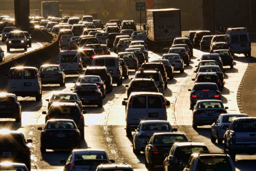 According to the Southern California Association of Governments, a $4 toll in an area between two intersecting freeways in Santa Monica and Los Angeles would reduce traffic by 19 percent during rush hour. It would also boost bus ridership, biking and walking. (ASSOCIATED PRESS)