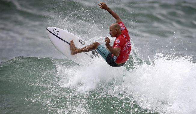 In this March 20, 2019, photo Kelly Slater of the U.S. surfs during his heat in the Sydney Surf Pro at Manly in Sydney, Australia. Slater placed last in his three-man opening heat and was last again in his second-round elimination heat Thursday, April 4, 2019, at the season-opening Quiksilver Pro at Australia&#x27;s Gold Coast in the World Surf League event which marks the start of Olympic qualifying for surfing. (Dan Himbrechts/AAP Image via AP)