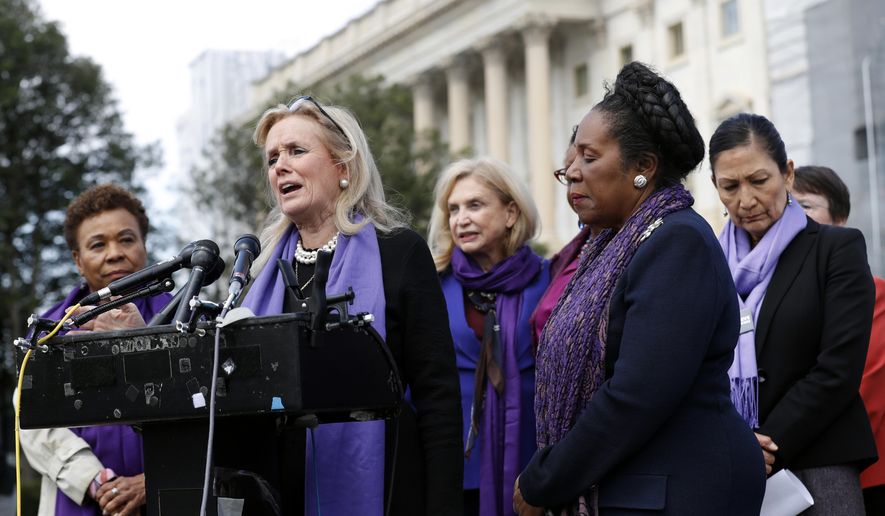 Rep. Debbie Dingell, D-Mich., speaks as Rep. Barbara Lee, D-Calif., left, and Rep. Sheila Jackson Lee, D-Texas, second from right, listen at a news conference after the House voted to reauthorize the Violence Against Women Act, Thursday, April 4, 2019, on Capitol Hill in Washington. At right is Rep. Deb Haaland, D-N.M. (AP Photo/Patrick Semansky)
