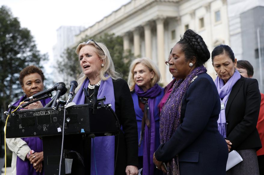 Rep. Debbie Dingell, D-Mich., speaks as Rep. Barbara Lee, D-Calif., left, and Rep. Sheila Jackson Lee, D-Texas, second from right, listen at a news conference after the House voted to reauthorize the Violence Against Women Act, Thursday, April 4, 2019, on Capitol Hill in Washington. At right is Rep. Deb Haaland, D-N.M. (AP Photo/Patrick Semansky)
