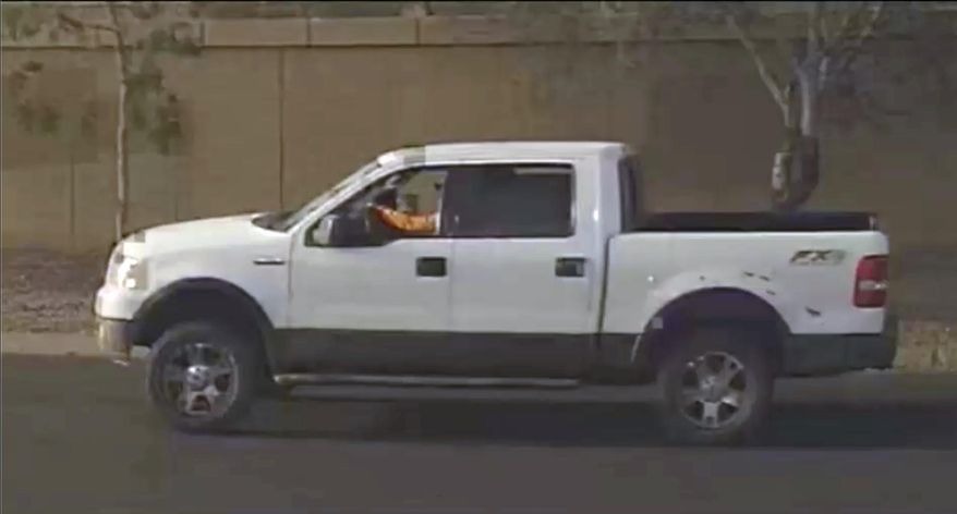 This photo provided by the Phoenix Police Department shows a security video photo of what is believed to be the suspects vehicle in a road rage incident in Phoenix, Ariz. where a 10 year old girl was fatally shot. Sgt. Vince Lewis said the shooting that killed Summerbell Brown occurred Wednesday, April 3, 2019 when a man in a pickup truck that had been following a family's car fired several gunshots after the family pulled into their driveway. (Phoenix Police Department via AP)