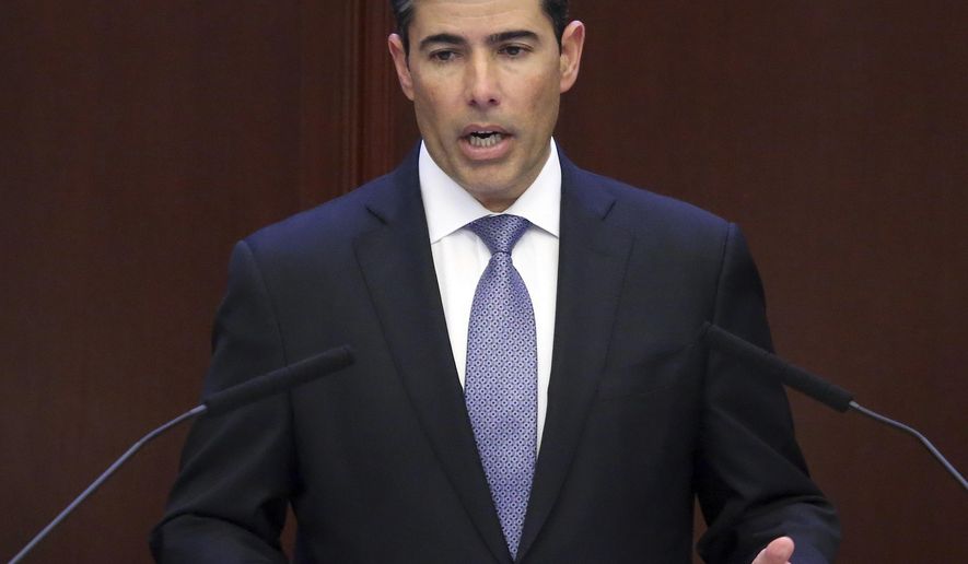 House speaker Rep. Jose Oliva, R-Miami Lakes, praises those who worked on the budget during session Thursday April 4, 2019, in Tallahassee, Fla. (AP Photo/Steve Cannon)
