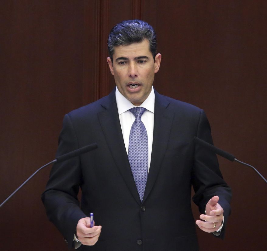 House speaker Rep. Jose Oliva, R-Miami Lakes, praises those who worked on the budget during session Thursday April 4, 2019, in Tallahassee, Fla. (AP Photo/Steve Cannon)