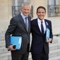French Economy and Finance Minister Bruno Le Maire, left poses with Cedric O, new junior minister for Digital Affairs as they walk out after the weekly cabinet meeting at the ELysee Palace in Paris, Monday, April 1, 2019. French President Emmanuel Macron has appointed three new government members, including the minister who will be in charge of handling Brexit-related issues. (AP Photo/Francois Mori)