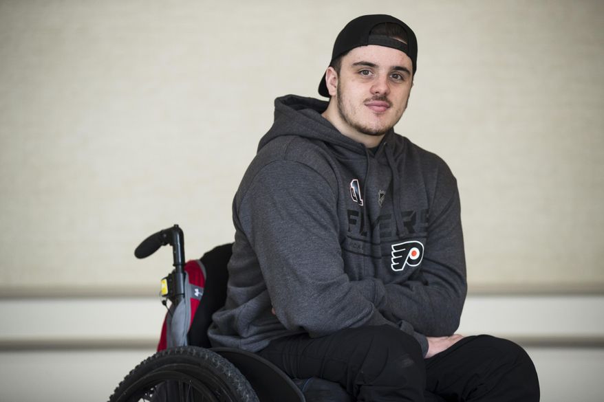 In this Wednesday, March 20, 2019 photo, Ryan Straschnitzki poses for a photograph in Philadelphia, Straschnitzki, a young hockey player was paralyzed in the Humboldt Broncos bus crash in Canada. (AP Photo/Matt Rourke)