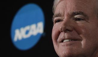FILE - In this March 29, 2018, file photo, NCAA President Mark Emmert speaks during a news conference in San Antonio. Emmert says a judge’s recent ruling in a federal antitrust lawsuit again reinforced that college athletes should be treated as students not employees. Emmert spoke to The Associated Press on Wednesday, April 3, at U.S. Bank Stadium, the site of the men’s basketball Final Four, making his first public comments since last month’s decision. Judge Claudia Wilken ruled the NCAA did violate antitrust laws and cannot prohibit schools from providing more benefits to athletes as long as they are tethered to education. (AP Photo/David J. Phillip, File)
