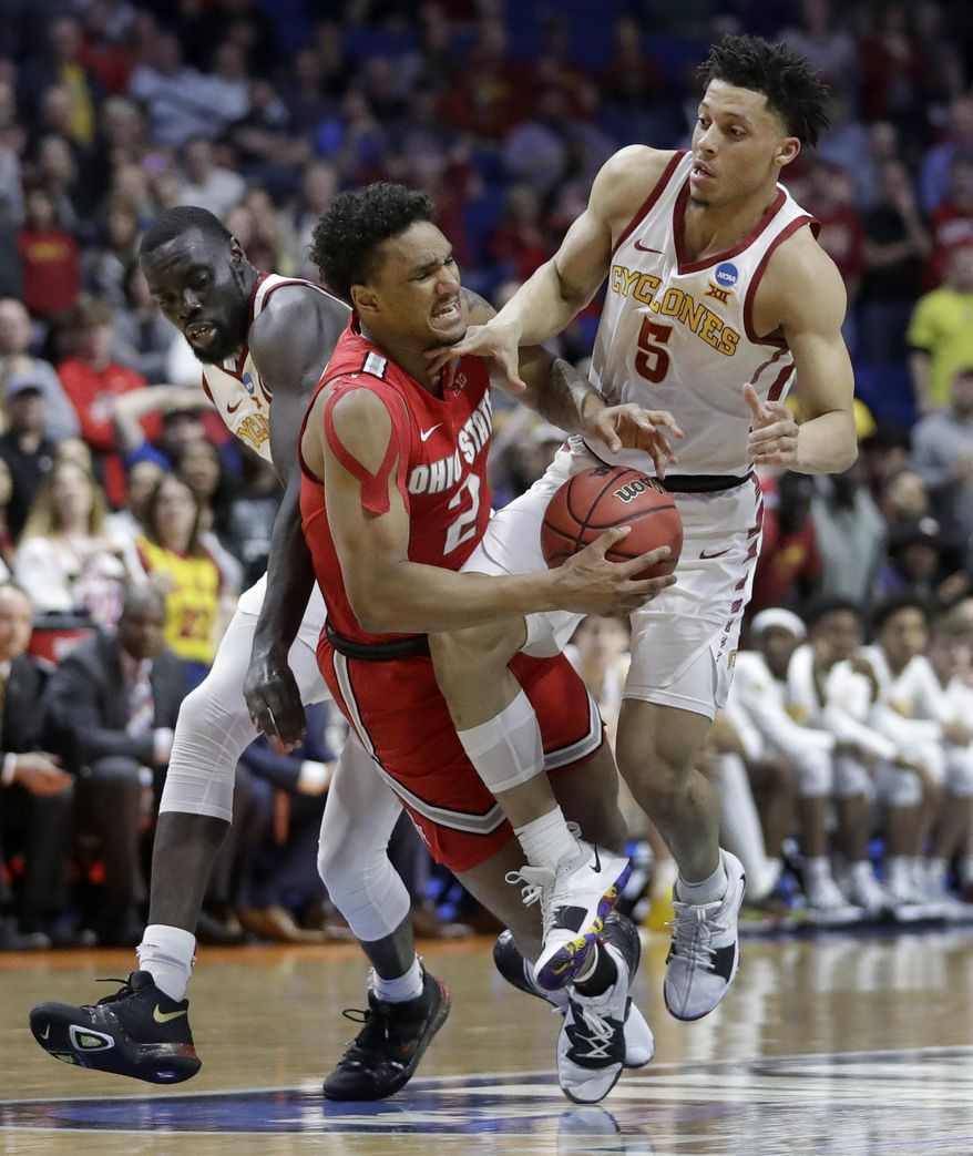 Ohio State's Musa Jallow (2) collides with Iowa State's Marial Shayok, left, and Lindell Wigginton (5) during the second half of a first round men's college basketball game in the NCAA Tournament Friday, March 22, 2019, in Tulsa, Okla. Ohio State won 62-59. (AP Photo/Jeff Roberson)