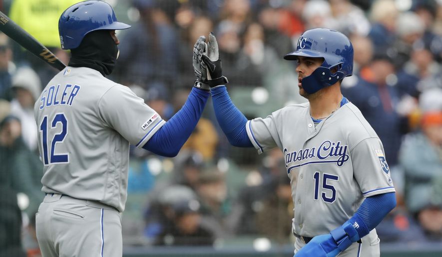 Kansas City Royals' Whit Merrifield (15) scores on a sacrifice fly to left by teammate Alex Gordon during the fifth inning of a baseball game against the Detroit Tigers, Thursday, April 4, 2019, in Detroit. (AP Photo/Carlos Osorio)