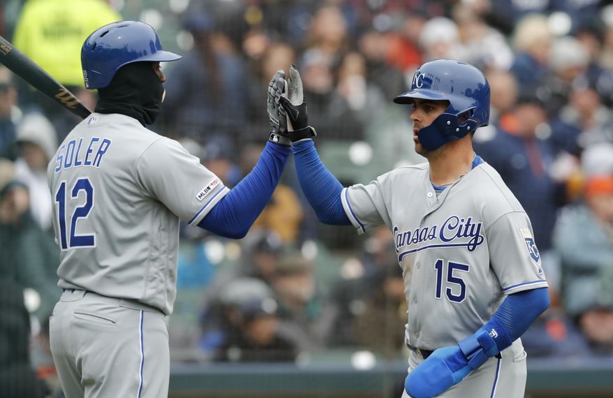 Kansas City Royals' Whit Merrifield (15) scores on a sacrifice fly to left by teammate Alex Gordon during the fifth inning of a baseball game against the Detroit Tigers, Thursday, April 4, 2019, in Detroit. (AP Photo/Carlos Osorio)