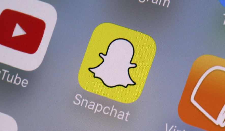 This Aug. 9, 2017, file photo shows the Snapchat app on a mobile device in New York. (AP Photo/Richard Drew, File) **FILE**