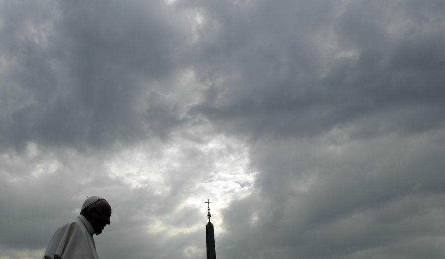 Pope Francis is silhouetted against a cloudy sky as he arrives for his weekly general audience, in St. Peter's Square, at the Vatican, Wednesday, April 3, 2019. (AP Photo/Gregorio Borgia)