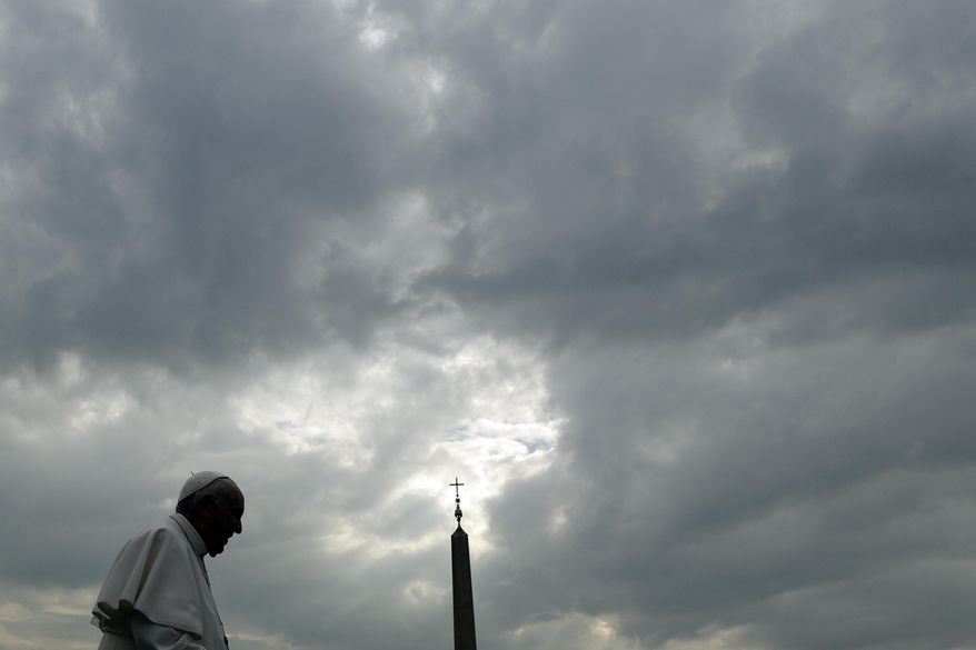 Pope Francis is silhouetted against a cloudy sky as he arrives for his weekly general audience, in St. Peter's Square, at the Vatican, Wednesday, April 3, 2019. (AP Photo/Gregorio Borgia)