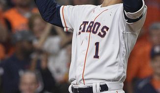 Houston Astros&#39; Carlos Correa celebrates his solo home run off Oakland Athletics starting pitcher Frankie Montas during the fourth inning of a baseball game, Friday, April 5, 2019, in Houston. (AP Photo/Eric Christian Smith)