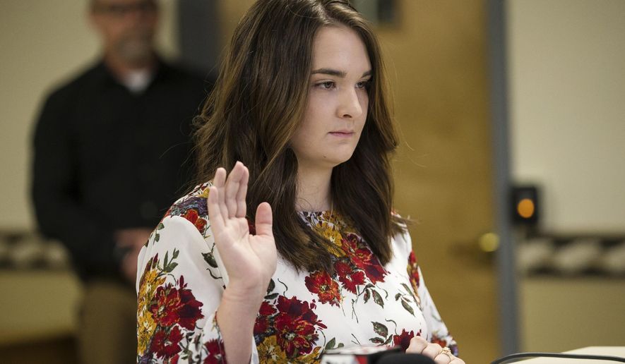 Santana Renee Adams is arraigned on charges for falsely reporting an emergency incident at Cabell County Magistrate Court, Friday, April 5, 2019, in Huntington, W.Va. The charges stem from Adams falsely reporting that an Egyptian man attempted to kidnap her daughter from a West Virginia shopping mall Monday evening. (Sholten Singer/The Herald-Dispatch via AP)