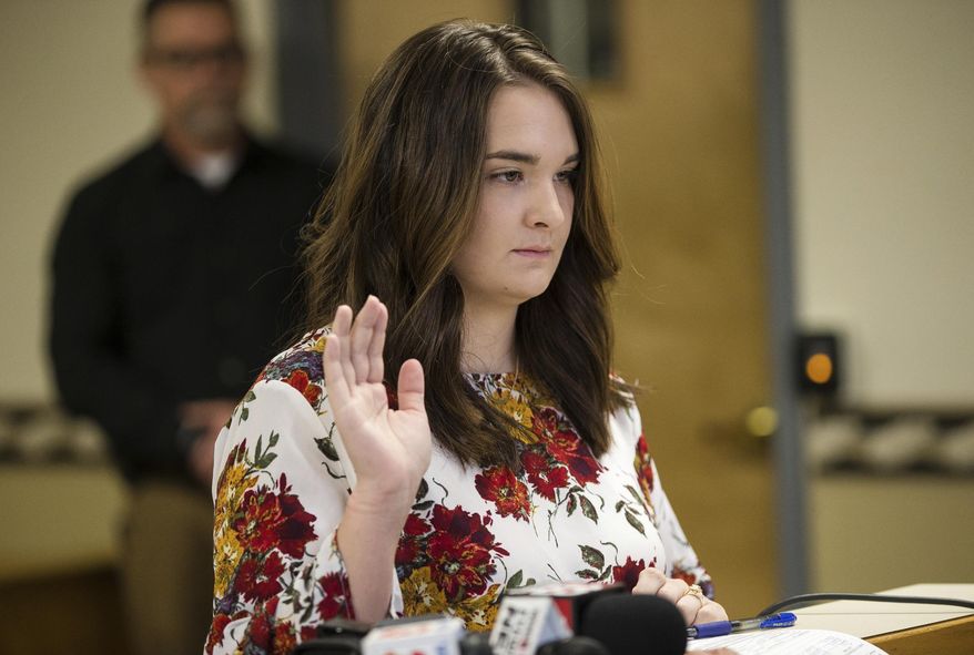 Santana Renee Adams is arraigned on charges for falsely reporting an emergency incident at Cabell County Magistrate Court, Friday, April 5, 2019, in Huntington, W.Va. The charges stem from Adams falsely reporting that an Egyptian man attempted to kidnap her daughter from a West Virginia shopping mall Monday evening. (Sholten Singer/The Herald-Dispatch via AP)