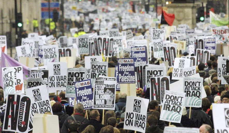 FILE - In this Feb. 15, 2003 file photo, anti-war protesters pack London's Whitehall during a march to demonstrate against a possible war against Iraq. The tumult was one of the great crises to afflict Britain in the postwar period, the latest of which relates to the country's struggles to leave the European Union. (AP Photo/Alastair Grant, File)