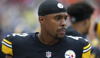 FILE - In this Sept. 9, 2018, file photo, Pittsburgh Steelers defensive back Morgan Burnett stands on the sideline during the first half of an NFL football game against the Cleveland Browns, in Cleveland. The Browns intend to sign former Packers and Steelers safety Morgan Burnett and quarterback Garrett Gilbert, who played in the failed Alliance of American Football, a person familiar with the plans told The Associated Press on Friday, April 5, 2019. Burnett, who was released by Pittsburgh earlier this week, could get a multi-year deal with Cleveland, said the person who spoke on condition of anonymity because the deals are still pending physicals.(AP Photo/Ron Schwane, File)