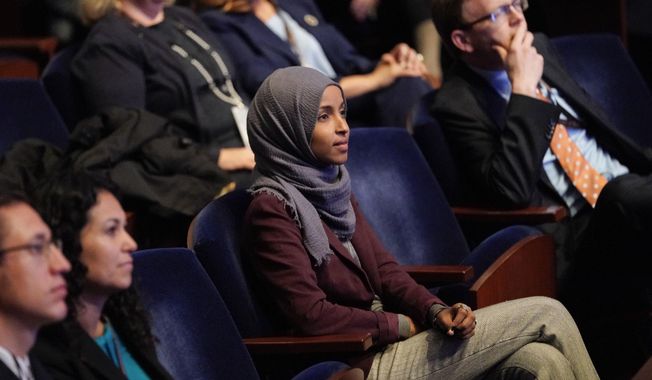 In this Nov. 15, 2018 file photo, Rep.-elect IIhan Omar, D-Minn., center, listens during member-elect orientations on Capitol Hill in Washington. (AP Photo/Pablo Martinez Monsivais, File)