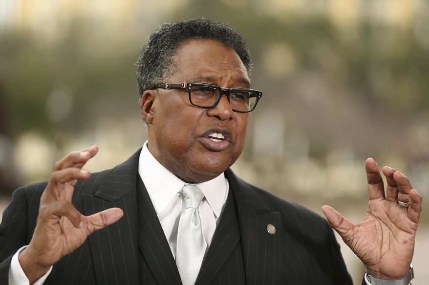 FILE - In this Feb. 19, 2018 file photo, former Dallas city council member Dwaine Caraway, speaks during a news conference in Dallas. Dallas Mayor Pro Tem Caraway accepted more than $450,000 in kickbacks and bribes, in part through a phony consulting agreement, gambling money and trips to Las Vegas and elsewhere, federal prosecutors said Thursday April 4, 2019. Caraway, the second highest-ranking elected official in Dallas, pleaded guilty to two federal charges in the public corruption case and has resigned from the Dallas City Council. (Andy Jacobsohn/The Dallas Morning News via AP File)
