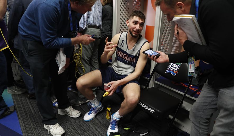 Virginia's Ty Jerome answers questions after a practice session for the semifinals of the Final Four NCAA college basketball tournament, Thursday, April 4, 2019, in Minneapolis. (AP Photo/Jeff Roberson)