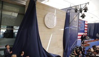 In this May 14, 2018, file photo, U.S. President Donald Trump&#39;s daughter Ivanka Trump, left, and U.S. Treasury Secretary Steve Mnuchin unveil an inauguration plaque during the opening ceremony of the new U.S. Embassy in Jerusalem. (AP Photo/Sebastian Scheiner, File)