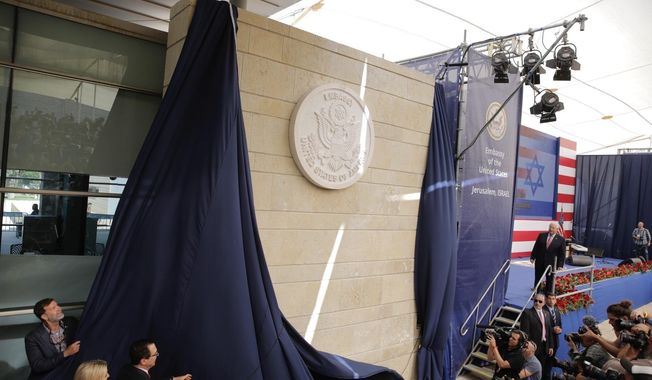 In this May 14, 2018, file photo, U.S. President Donald Trump&#x27;s daughter Ivanka Trump, left, and U.S. Treasury Secretary Steve Mnuchin unveil an inauguration plaque during the opening ceremony of the new U.S. Embassy in Jerusalem. (AP Photo/Sebastian Scheiner, File)