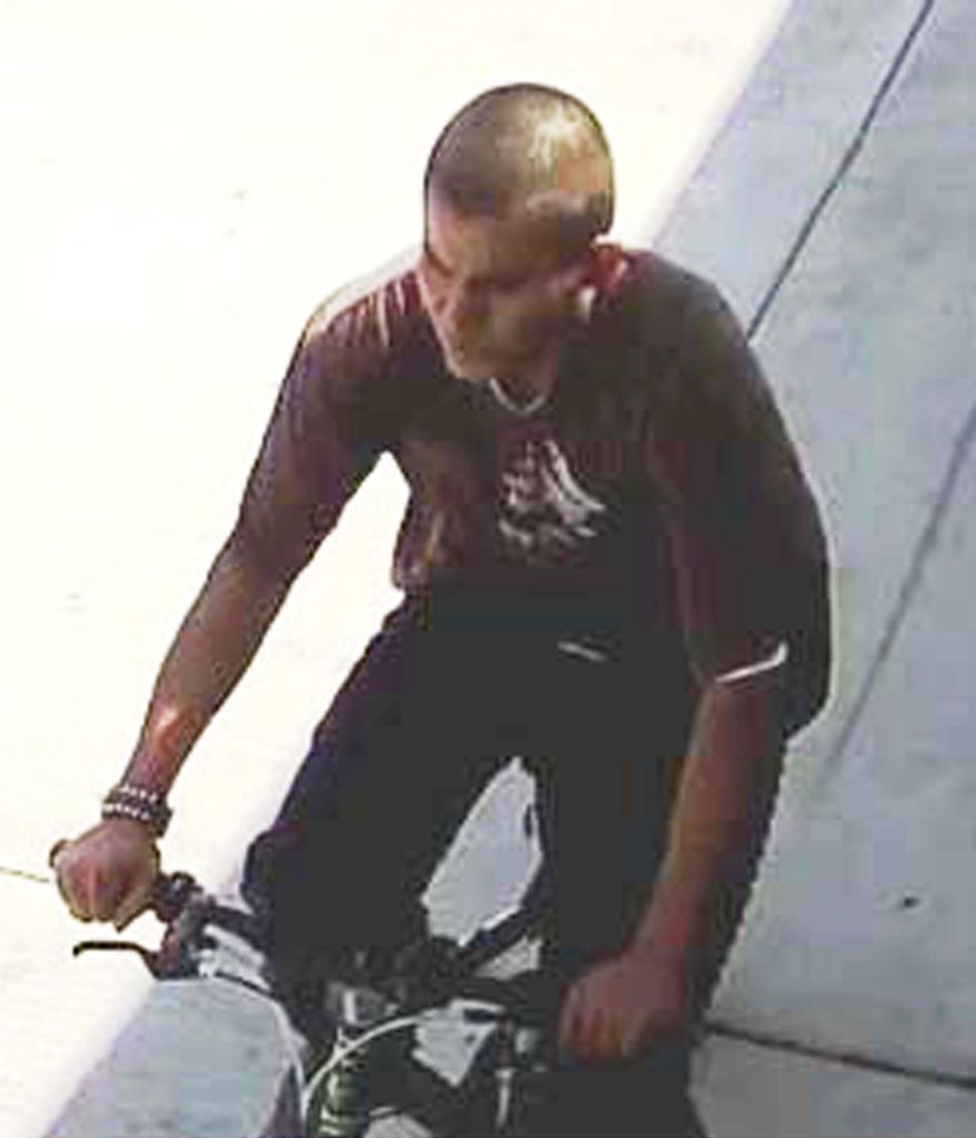 FILE - This undated file photo released by the Los Angeles Police Department shows a suspect being sought in a series of slashing attacks recently in Los Angeles. The man who rode around on a bicycle with a knife and slashed the faces and necks of nine people in Los Angeles has been charged with multiple felonies. The LA County district attorney's office says Friday, April 5, 2019, that Lenrey Briones, 19, faces seven counts of aggravated mayhem, two counts of attempted aggravated mayhem and one count of attempted second-degree robbery. (Los Angeles Police Department via AP, File)