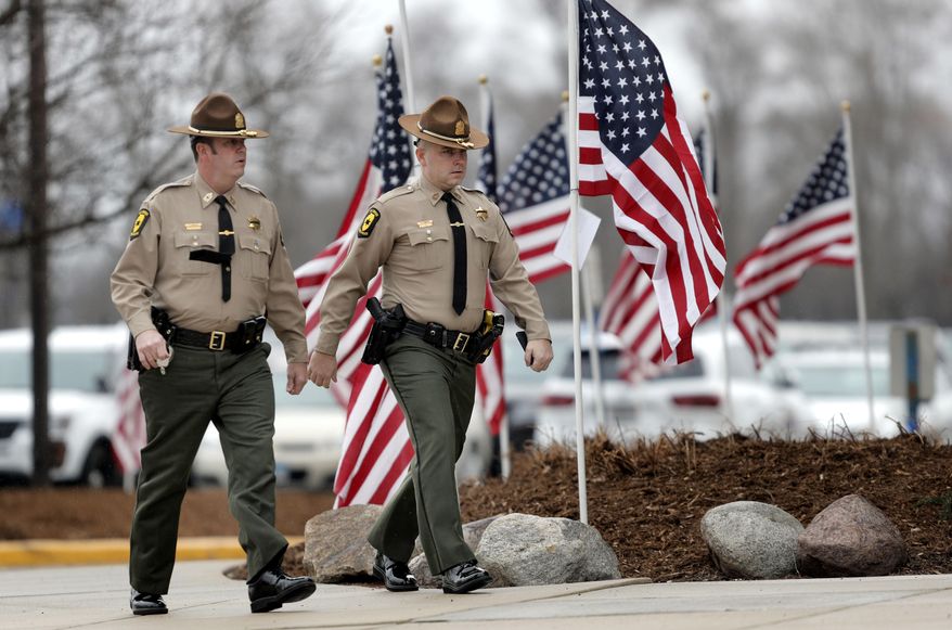 Visitation was held Thursday, April 4, 2019 in Grayslake, Ill. for Illinois State Trooper Gerald Ellis. Ellis died March 30 when Dan Davies, 44, of Calumet City, was driving in the wrong direction in the westbound lanes of I-94 and slammed into Ellis' squad car near Green Oaks, east of Libertyville, authorities said. Ellis, an Antioch resident, was 36. (Steve Lundy/Daily Herald via AP)