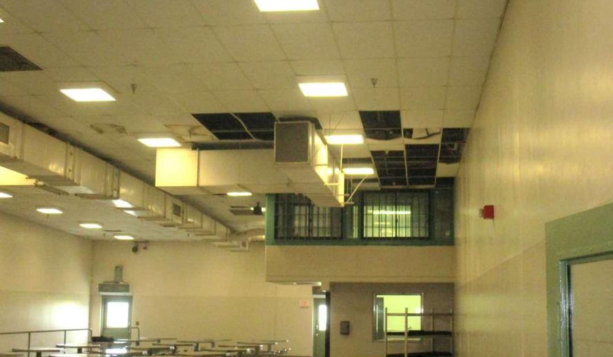 In this undated photo provided by the Prison Law Office, a non-profit public interest law firm that provides free legal services to prison inmates, is a dining hall where damaged ceiling tiles have been removed at the California Substance Abuse Treatment Facility and State Prison in Corcoran, Calif. California is spending $260 million over four years to repair leaking roofs and clear dangerous mold that imperils more than two dozen deteriorating prisons. An inmate lawsuit over the conditions says the repairs aren't moving fast enough. (Prison Law Office via AP)